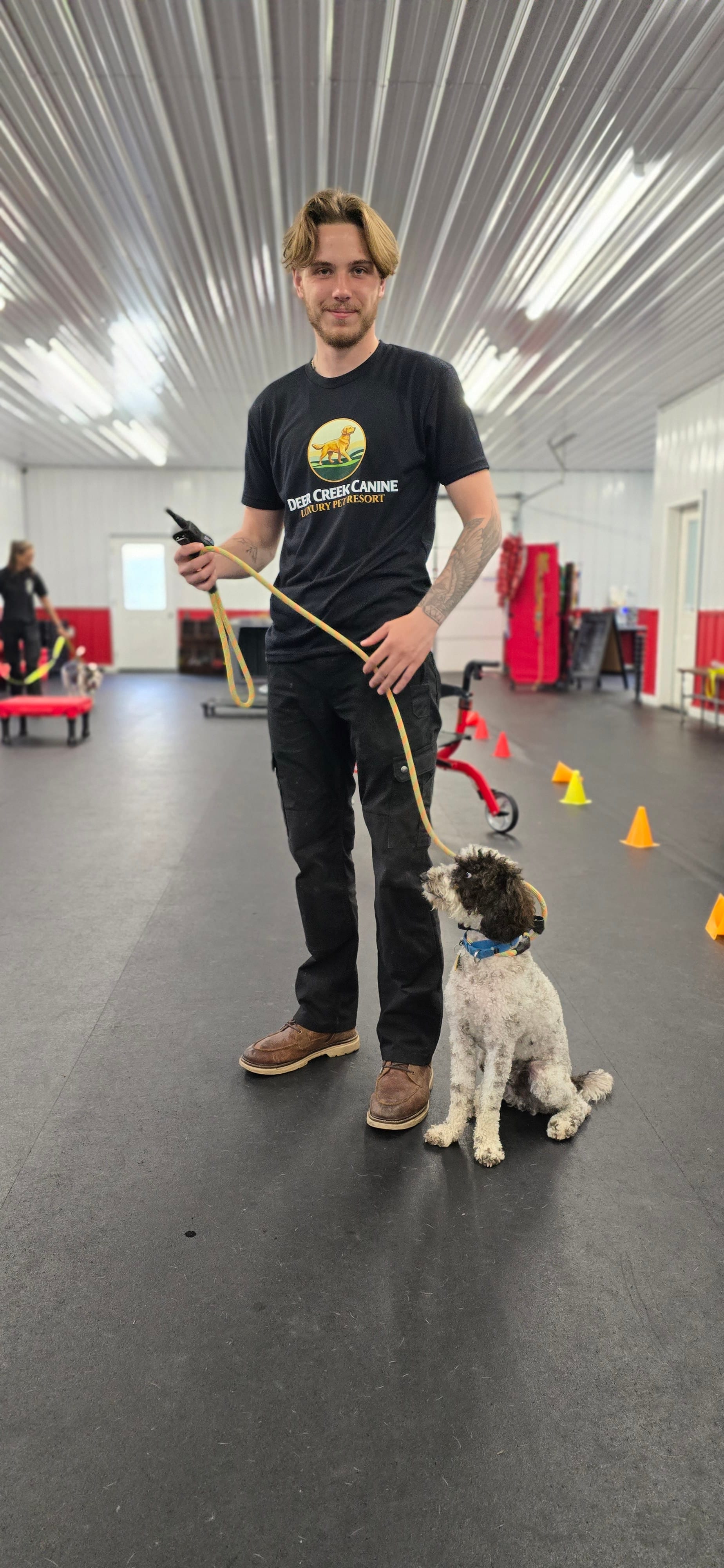 A Deer Creek staff member giving individualized attention to a calm dog